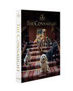 Libro The Connaught de Assouline cerrado con perros en portada y lomo vertical
