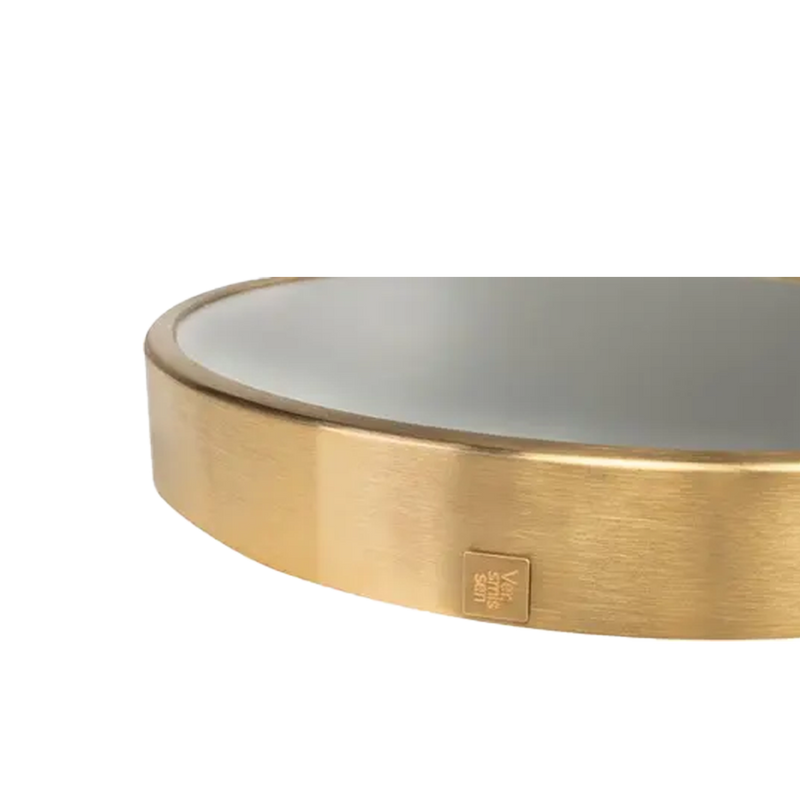 Espejo circular dorado: marco metálico con etiqueta rectangular en el borde